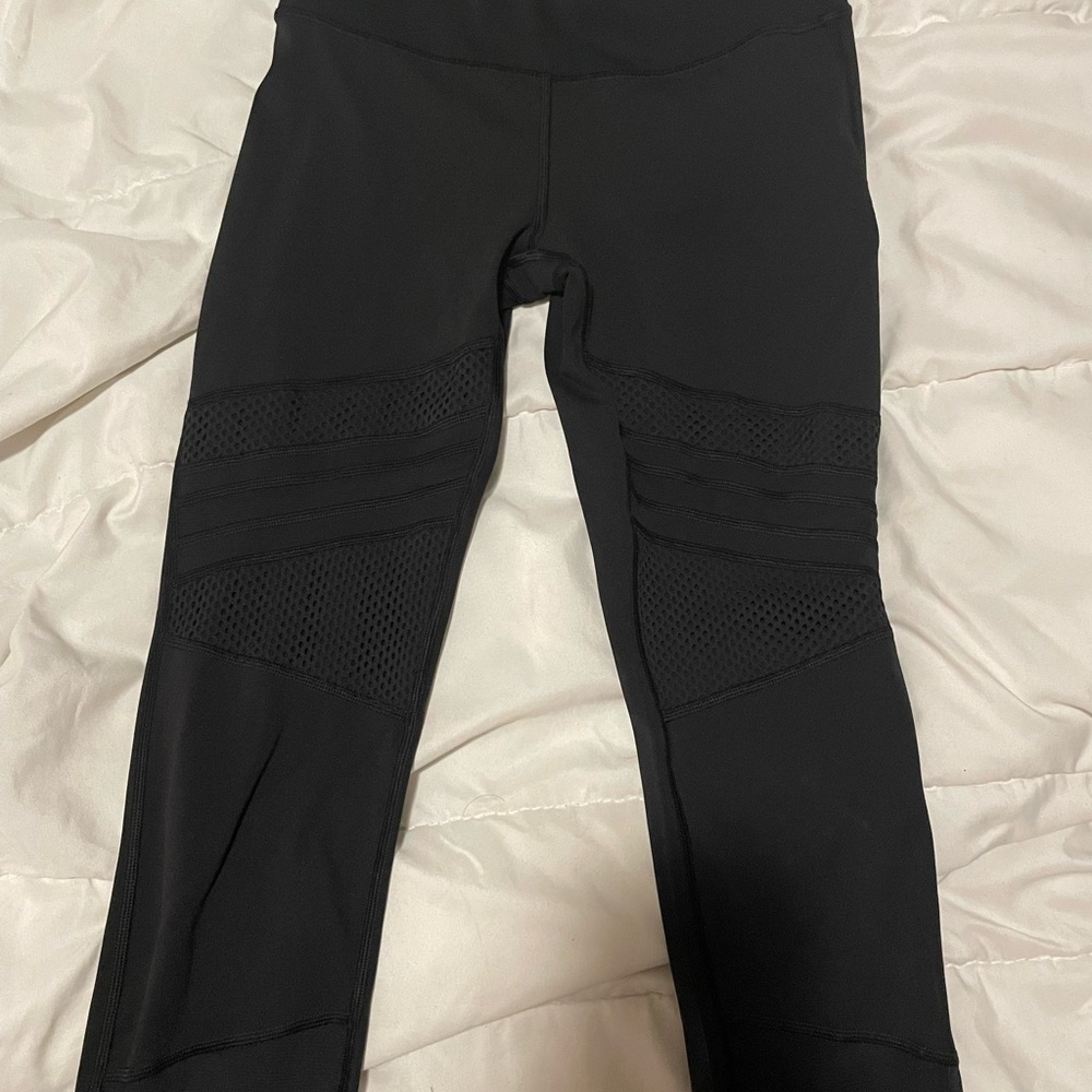Black lululemon leggings with sheer and fishnet details. In great condition.